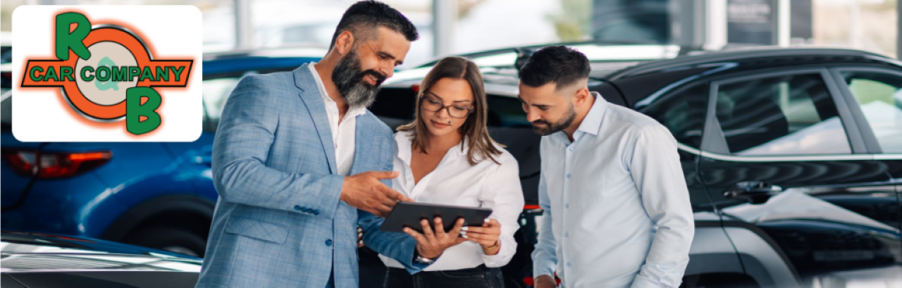 Friendly staff assisting customers while browsing the inventory of high-quality used vehicles at R&B Car Company.